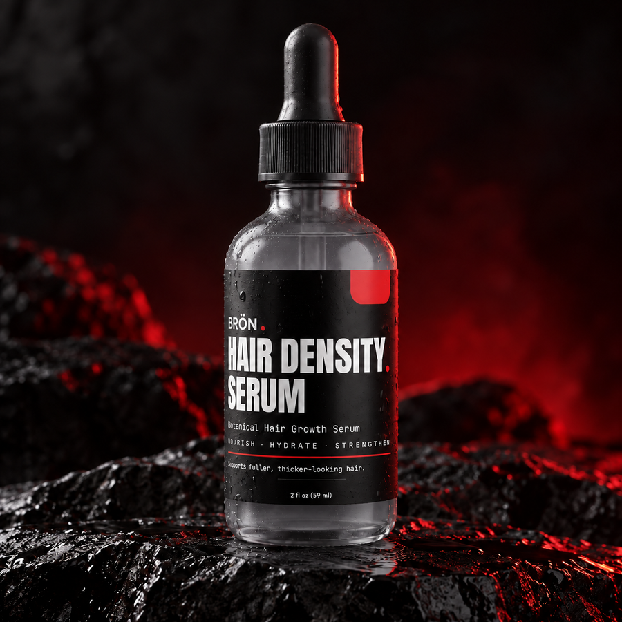 BRÖN Hair Density Serum in translucent smoke-gray glass with clear colorless serum and black dropper