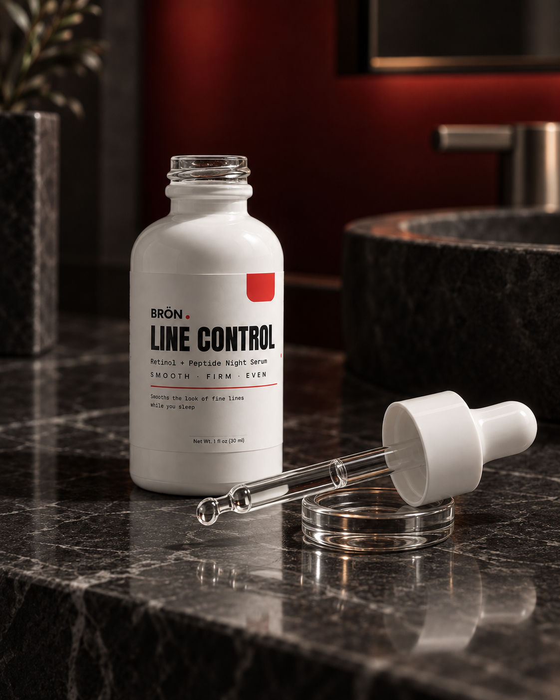 BRÖN LINE CONTROL night serum and glass dropper on a dark bathroom vanity