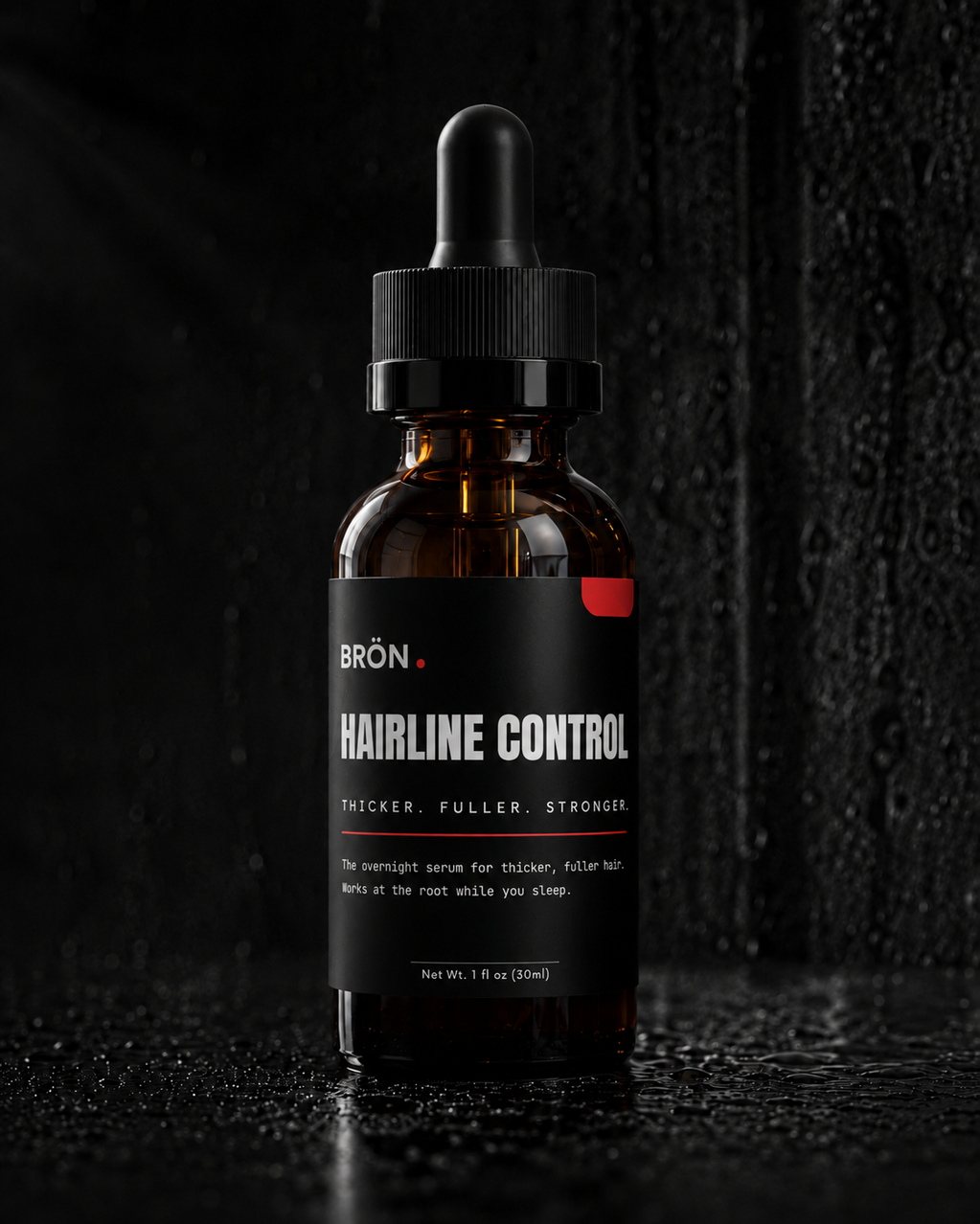 BRÖN Hairline Control hair density serum bottle on wet dark stone