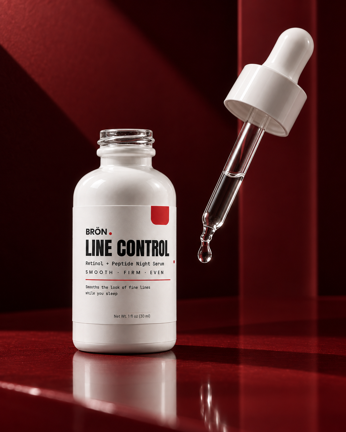 Clear LINE CONTROL night serum in a glass pipette beside the white BRÖN bottle