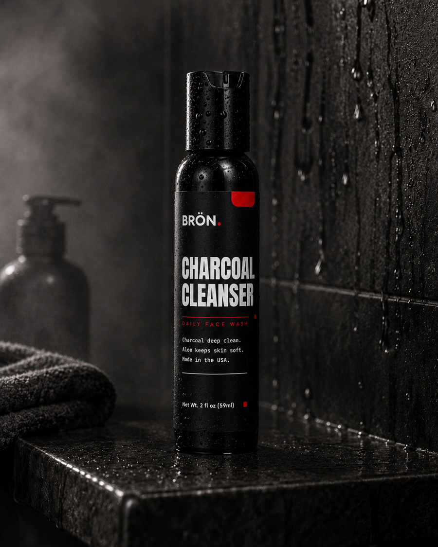 BRON Charcoal Cleanser on a wet shower shelf