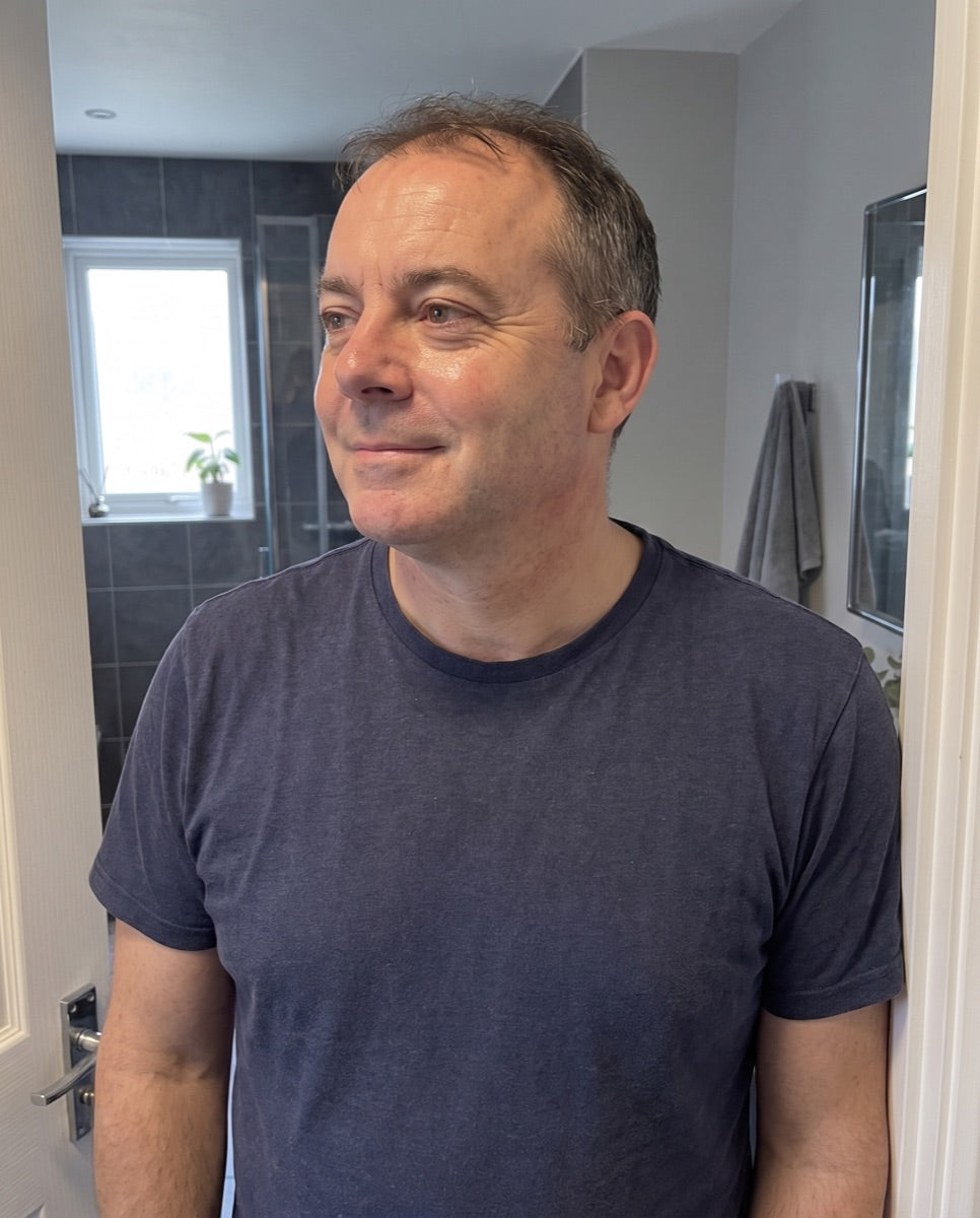 Man in his fifties after his morning skincare routine